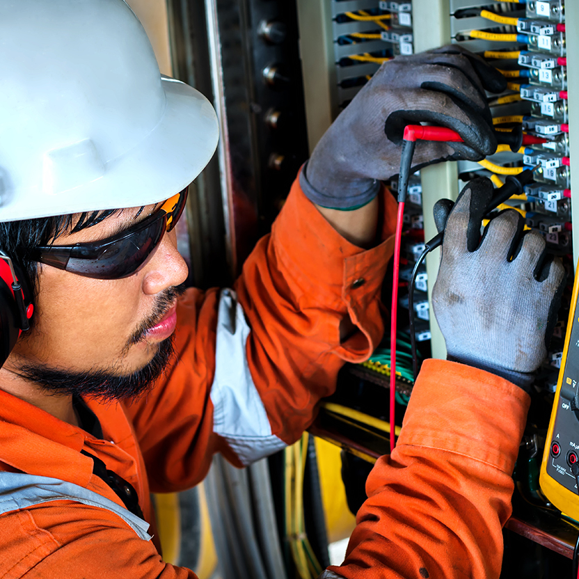 Technician working on a fuse box